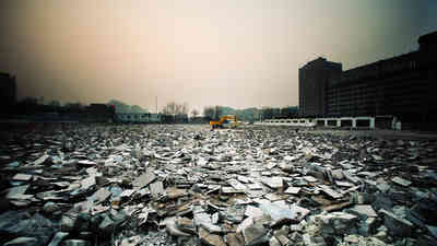 Picture of vast ground in a city with a heap of rubble.